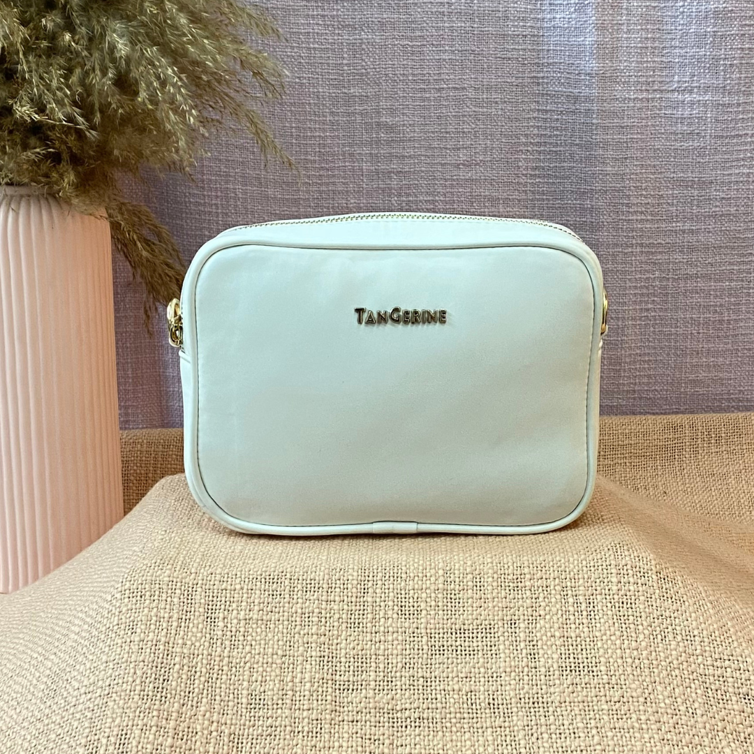 White Dual Compartment Sling Bag with Multi-color Lines Belt